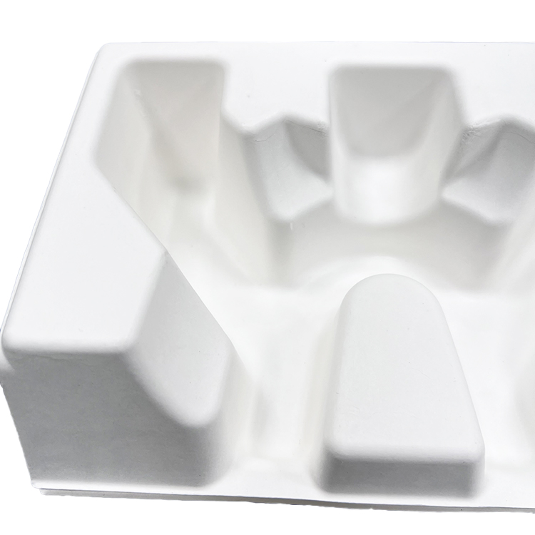 Wet press moulded pulp trays